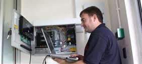 A Technician Programming a Secuirty Alarm System